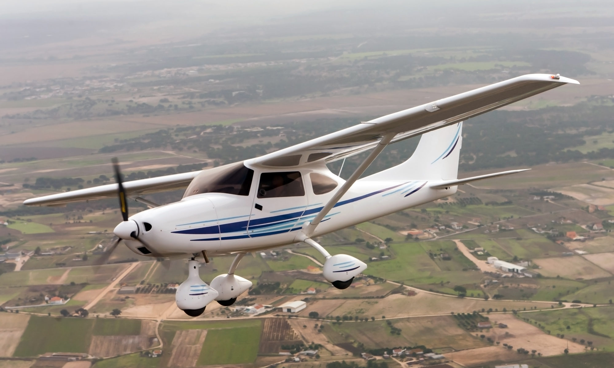 A small propeller plane turns to the right